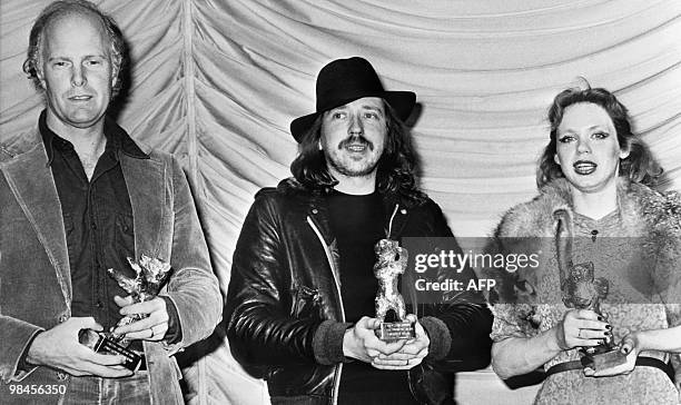 The laureates of the Golden Berlin Bear Film Award pose with their trophy, on February 6, 1980 at the 60th Berlinale Film Festival in Berlin. From L...