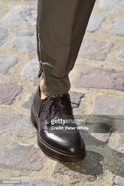 Model, shoe detail, walks the runway during the Hermes Menswear Spring/Summer 2019 show as part of Paris Fashion Week on June 23, 2018 in Paris,...