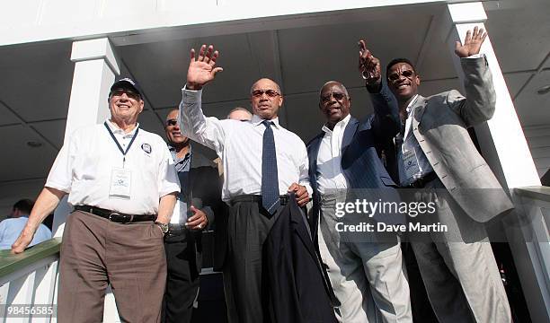 Baseball Hall of Famers wave to fans following ceremonies opening the Hank Aaron Museum at the Hank Aaron Stadium on April 14, 2010 in Mobile,...