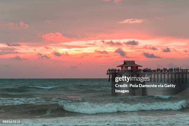 naples pier and calm ocean, florida - pola damonte stockfoto's en -beelden