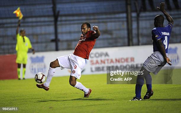 Brazil's Internacional Alecsandro vies for the ball with Ecuador's Emelec Luis Alberto Zambrano during their Copa Libertadores 2010 football match at...