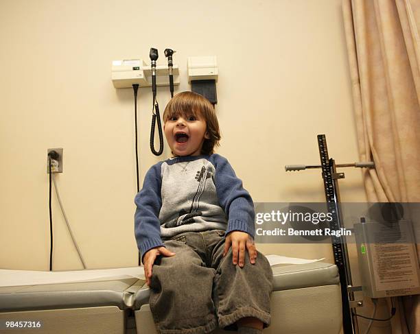 Patient David DeNunzio plays with Gracie the Dalmatian f\of '101' Dalmatians the Musical during Gracie's visit hospitalized children at Beth Israel...