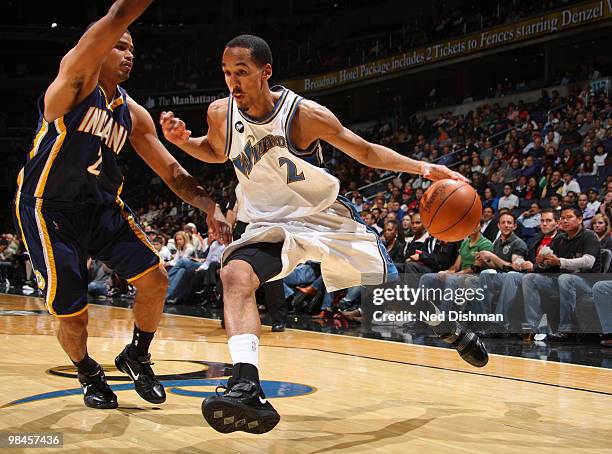 Shaun Livingston of the Washington Wizards drives against Earl Watson of the Indiana Pacers at the Verizon Center on April 14, 2010 in Washington,...