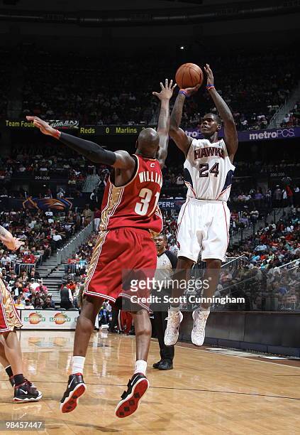 Marvin Williams of the Atlanta Hawks puts up a shot against Jawad Williams of the Cleveland Cavaliers on April 14, 2010 at Philips Arena in Atlanta,...