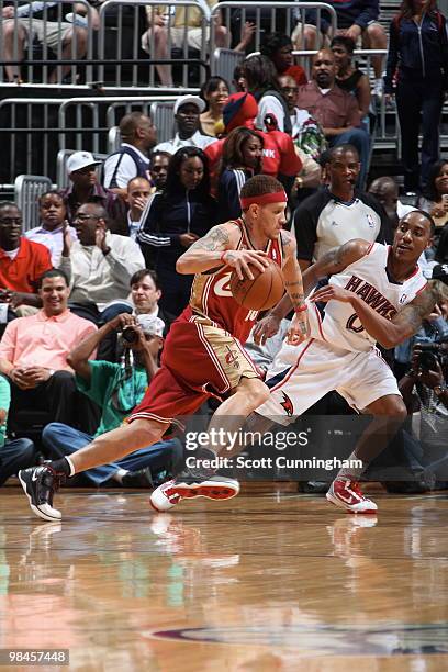 Delonte West of the Cleveland Cavaliers drives against Jeff Teague of the Atlanta Hawks on April 14, 2010 at Philips Arena in Atlanta, Georgia. NOTE...