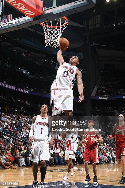 Jeff Teague of the Atlanta Hawks dunks against the Cleveland Cavaliers on April 14, 2010 at Philips Arena in Atlanta, Georgia. NOTE TO USER: User...