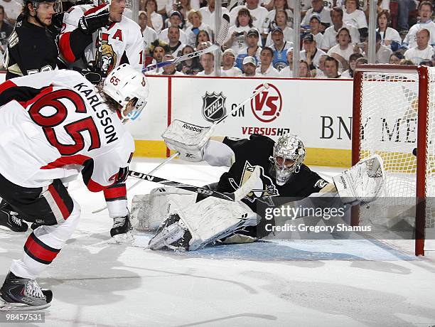 Erik Karlsson of the Ottawa Senators scores on Marc-Andre Fleury of the Pittsburgh Penguins in Game One of the Eastern Conference Quaterfinals during...