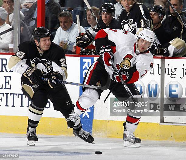 Matt Cullen of the Ottawa Senators moves the puck up ice against Ruslan Fedotenko of the Pittsburgh Penguins in Game One of the Eastern Conference...