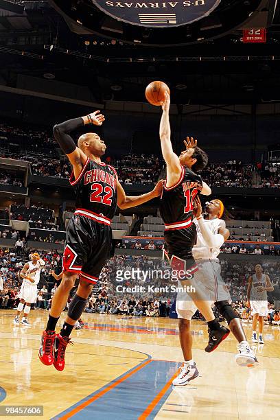 Kirk Hinrich of the Chicago Bulls blocks against Gerald Wallace of the Charlotte Bobcats on April 14, 2010 at the Time Warner Cable Arena in...