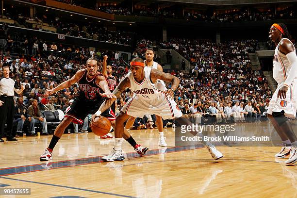 Tyrus Thomas of the Charlotte Bobcats goes for the steal against Joakim Noah of the Chicago Bulls on April 14, 2010 at the Time Warner Cable Arena in...