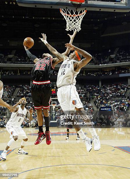 Tyrus Thomas of the Charlotte Bobcats blocks against Taj Gibson of the Chicago Bulls on April 14, 2010 at the Time Warner Cable Arena in Charlotte,...