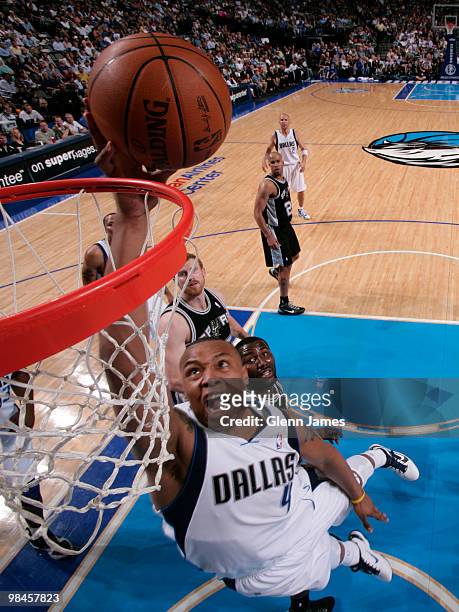 Caron Butler of the Dallas Mavericks goes in for the layup against the San Antonio Spurs during a game at the American Airlines Center on April 14,...