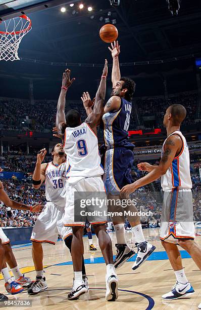 Hamed Haddadi of the Memphis Grizzlies shoots over Serge Ibaka of the Oklahoma City Thunder on April 14, 2010 at the Ford Center in Oklahoma City,...