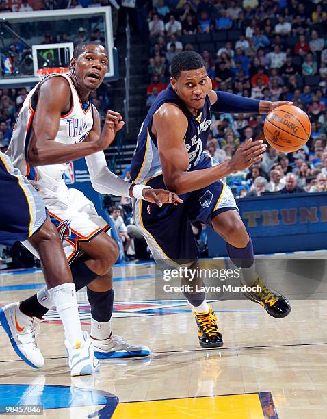 Rudy Gay of the Memphis Grizzlies drives past Kevin Durant of the Oklahoma City Thunder on April 14, 2010 at the Ford Center in Oklahoma City,...
