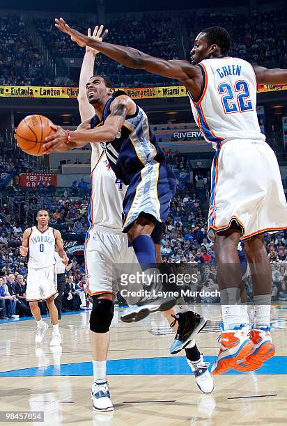 Mike Conley of the Memphis Grizzlies goes for the basket against Jeff Green of the Oklahoma City Thunder on April 14, 2010 at the Ford Center in...