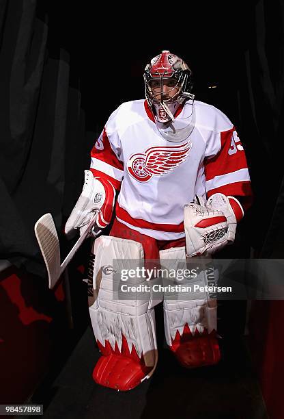 Goaltender Jimmy Howard of the Detroit Red Wings walks out onto the ice for warm ups to the Game One of the Western Conference Quarterfinals against...
