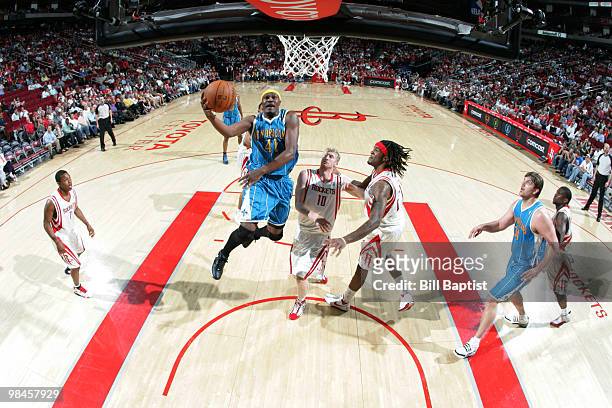 James Posey of the New Orleans Hornets shoots the ball over Chase Budinger of the Houston Rockets on April 14, 2010 at the Toyota Center in Houston,...