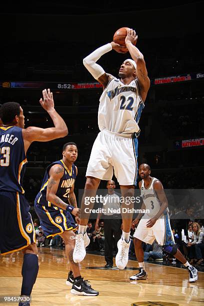 James Singleton of the Washington Wizards shoots against Danny Granger of the Indiana Pacers at the Verizon Center on April 14, 2010 in Washington,...