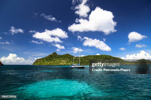 a yacht moored in the sea at carriacou, grenada. - karibien bildbanksfoton och bilder