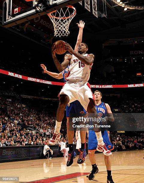 Amir Johnson of the Toronto Raptors tries a layup contested by Danilo Gallinari of the New York Knicks during a game on April 14, 2010 at the Air...