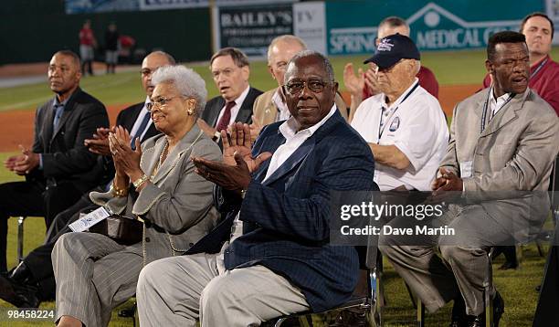 Baseball Hall of Famer Hank Aaron and his wife Billye applaud during pre-game ceremonies following the opening the Hank Aaron Museum at the Hank...