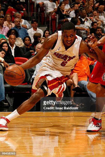 Mario Chalmers of the Miami Heat drives against the New Jersey Nets on April 14, 2010 at American Airlines Arena in Miami, Florida. NOTE TO USER:...