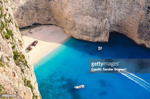high angle view of navagio beach in greece. - navagio stock pictures, royalty-free photos & images