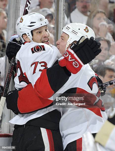 Jarkko Ruutu of the Ottawa Senators celebrates his goal with Chris Kelly against the Pittsburgh Penguins in Game One of the Eastern Conference...