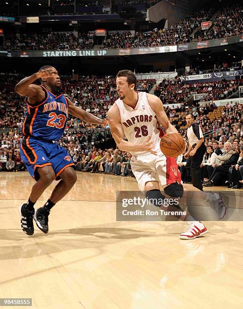 Hedo Turkoglu of the Toronto Raptors looks to drive past defender Toney Douglas of the New York Knicks during a game on April 14, 2010 at the Air...