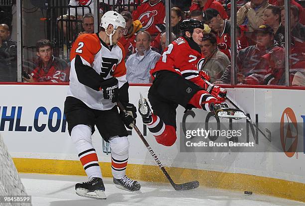 Lukas Krajicek of the Philadelphia Flyers sidesteps a check by David Clarkson of the New Jersey Devils in Game One of the Eastern Conference...