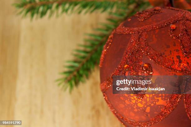 christmas red bauble and pine tree branches - red pine stock pictures, royalty-free photos & images