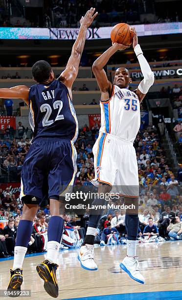 Kevin Durant of the Oklahoma City Thunder shoots over Rudy Gay of the Memphis Grizzlies on April 14, 2010 at the Ford Center in Oklahoma City,...