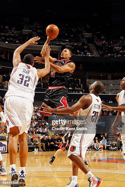 Boris Diaw of the Charlotte Bobcats blocks against Derrick Rose of the Chicago Bulls on April 14, 2010 at the Time Warner Cable Arena in Charlotte,...