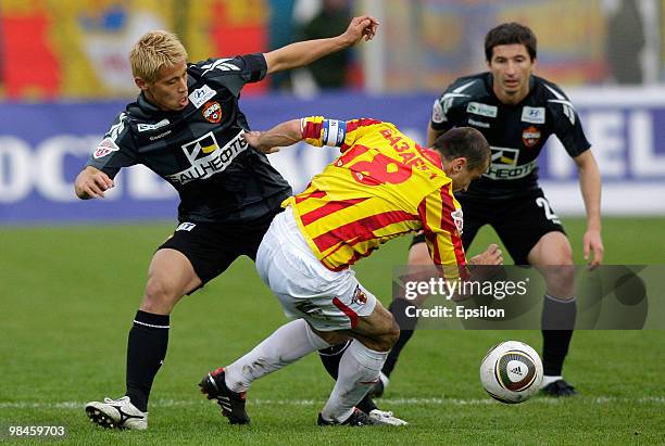 Keisuke Honda of PFC CSKA Moscow battles for the ball with Jambulad Bazayev of FC Alania Vladikavkaz during the Russian Football League Championship...