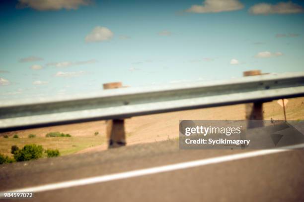 guard rail along highway and rural background - remote guarding stock pictures, royalty-free photos & images