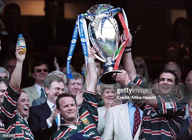 Captain Martin Johnson and Pat Howard of Leicester lift the Championship Trophy during the match between Bath and Leicester Tigers in the Zurich...