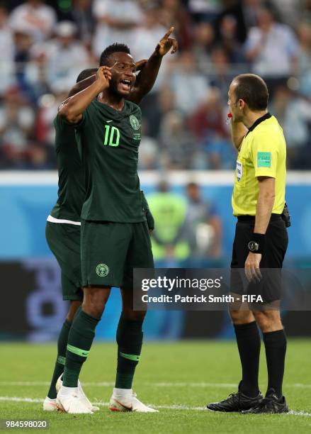 Referee Cuneyt Cakir listens to his headphones after Nigeria appeals for a penalty whic will be not given during the 2018 FIFA World Cup Russia group...