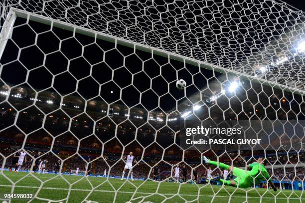 Iceland's midfielder Gylfi Sigurdsson scores a penalty kick during the Russia 2018 World Cup Group D football match between Iceland and Croatia at...