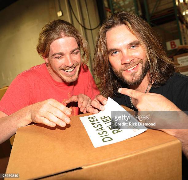 Former American Idol's Bucky Covington and Bo Bice participate in the "Idol Gives Back" Volunteer Program at the Second Harvest Food Bank of Middle...