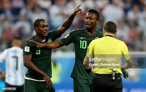 John Obi Mikel of Nigeria and Odion Ighalo of Nigeria argue with Referee Cuneyt Cakir during the 2018 FIFA World Cup Russia group D match between...