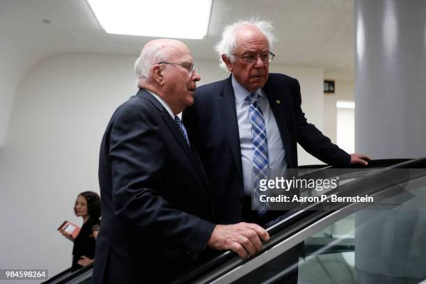 Sen. Patrick Leahy speaks with Sen. Bernie Sanders ahead of the weekly policy luncheons at the U.S. Capitol June 26, 2018 in Washington, DC....