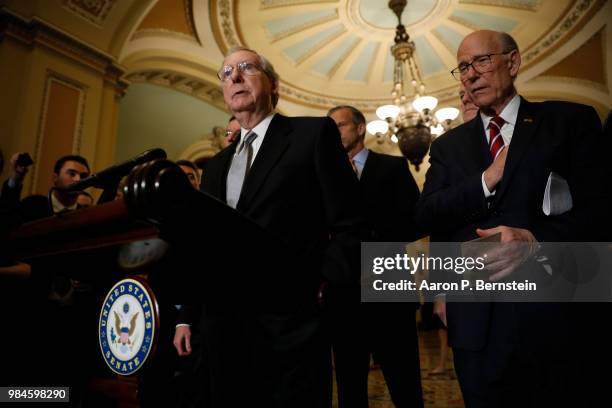 Senate Majority Leader Mitch McConnell, accompanied by Sen. Pat Roberts , speaks with reporters following the weekly policy luncheons at the U.S....