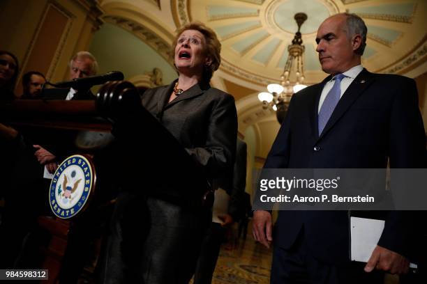 Sen. Debbie Stabenow , accompanied by Sen. Bob Casey , speaks with reporters following the weekly policy luncheons at the U.S. Capitol June 26, 2018...