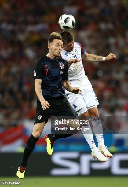 Ivan Rakitic of Croatia competes for a header with Johann Gudmundsson of Iceland during the 2018 FIFA World Cup Russia group D match between Iceland...