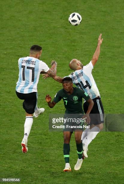 Nicolas Otamendi of Argentina wins a header ove Ahmed Musa of Nigeria during the 2018 FIFA World Cup Russia group D match between Nigeria and...