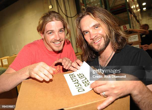 Former American Idol's Bucky Covington and Bo Bice participate in the "Idol Gives Back" Volunteer Program at the Second Harvest Food Bank of Middle...