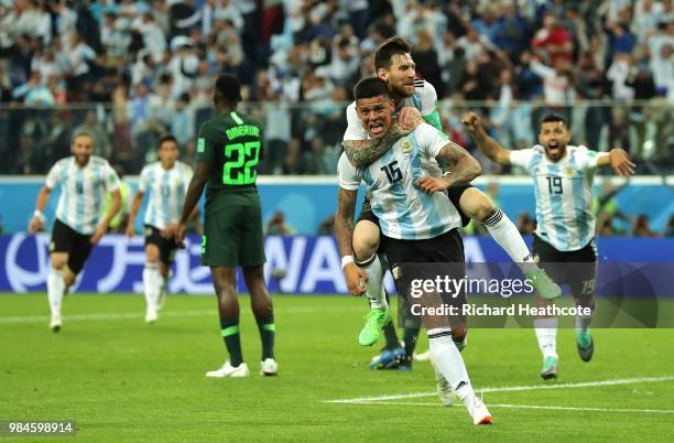 Marcos Rojo of Argentina celebrates after scoring his team's second goal with teammate Lionel Messi during the 2018 FIFA World Cup Russia group D...