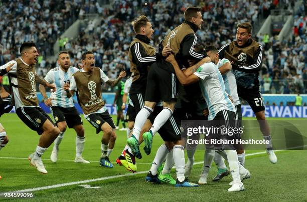 Marcos Rojo of Argentina celebrates with teammates after scoring his team's second goal during the 2018 FIFA World Cup Russia group D match between...