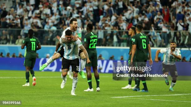 Marcos Rojo of Argentina celebrates after scoring his team's second goal with teammate Lionel Messi during the 2018 FIFA World Cup Russia group D...