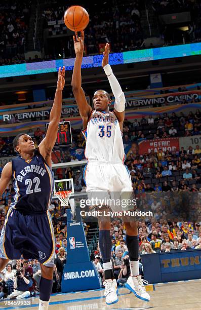 Kevin Durant of the Oklahoma City Thunder shoots over Rudy Gay of the Memphis Grizzlies on April 14, 2010 at the Ford Center in Oklahoma City,...